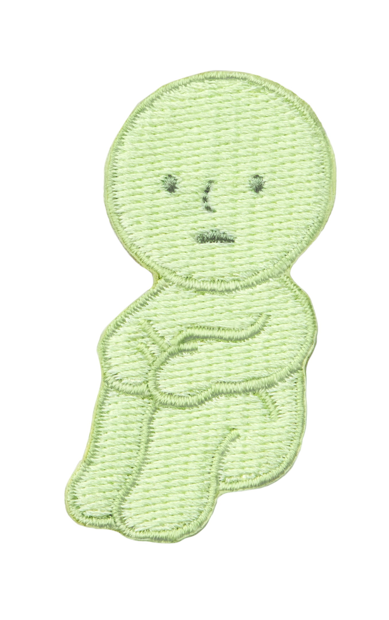 Image with transparent background shows SMISKI Embroidery Sticker "Hugging Knees" SMISKI is a light green figure with dark green eyes, nose and mouth with SMISKI's knees folded and hands atop knees.