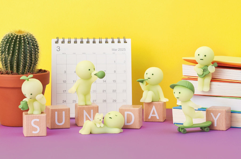lifestyle image featuring the main lineup for the smiski sunday series. from left to right: gardening, blowing bubbles, sunbathing, paper airplane, skateboarding, and sing-along